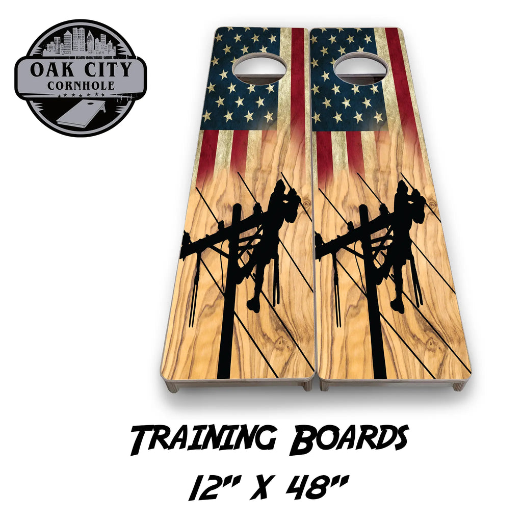 A striking image of premium, handcrafted cornhole boards featuring a detailed, high-resolution design depicting linemen working on power lines, set against a bold, patriotic backdrop. Perfect for tournament play and gatherings.