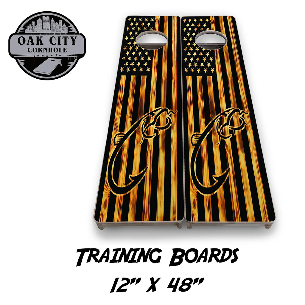 Wood-burned American flag cornhole board with a striking silhouette of a catfish and hook design.