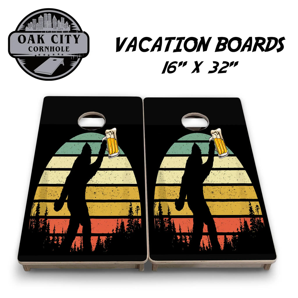 A cornhole board design featuring a silhouette of Bigfoot holding a beer mug against a vibrant, multicolored sunset background with trees at the bottom. The design showcases a playful and adventurous theme, perfect for outdoor gatherings and tournaments. 