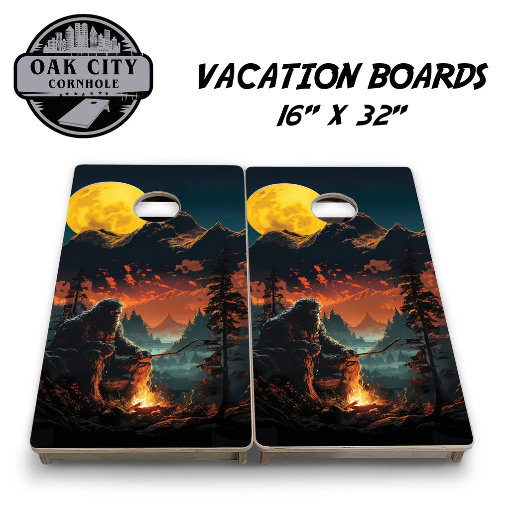 Premium handcrafted 24x48 cornhole boards featuring a 'Bigfoots Campfire' design from Oak City Cornhole. Perfect for tournaments with a high-resolution image of Bigfoot by a campfire in the woods.