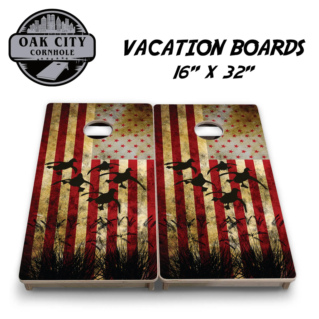 Patriotic Red Flag Duck Hunter Cornhole Boards from Oak City Cornhole, featuring a vibrant duck hunting scene with American flag accents.